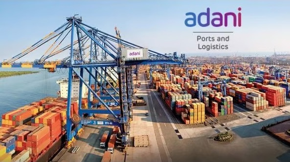 Adani Ports ships handling cargo containers at a bustling port.