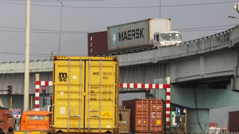 Urban freight trucks in a busy city street during peak hours.