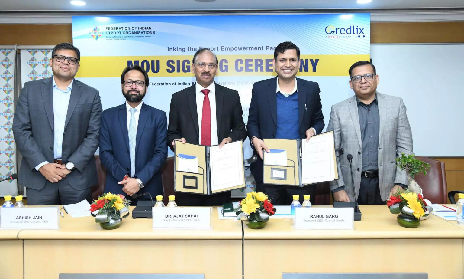 SCM Spectrum - FIEO and Credlix executives signing an MoU to support Indian exporters with financial and logistical solutions.