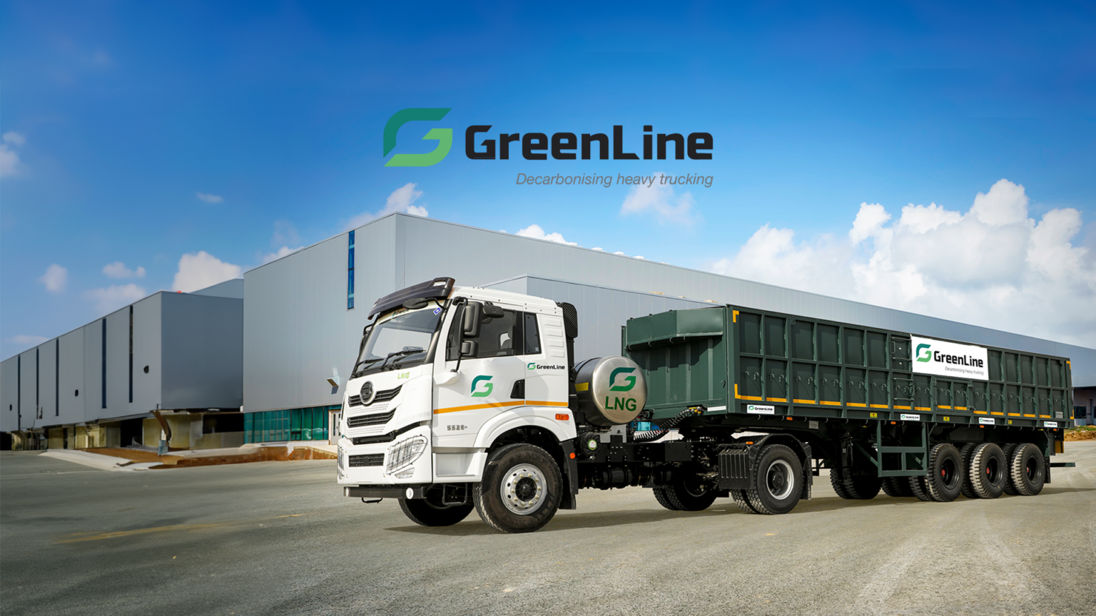 SCM Spectrum - A fleet of GreenLine LNG-powered trucks parked at a logistics hub, promoting sustainable transportation in India.