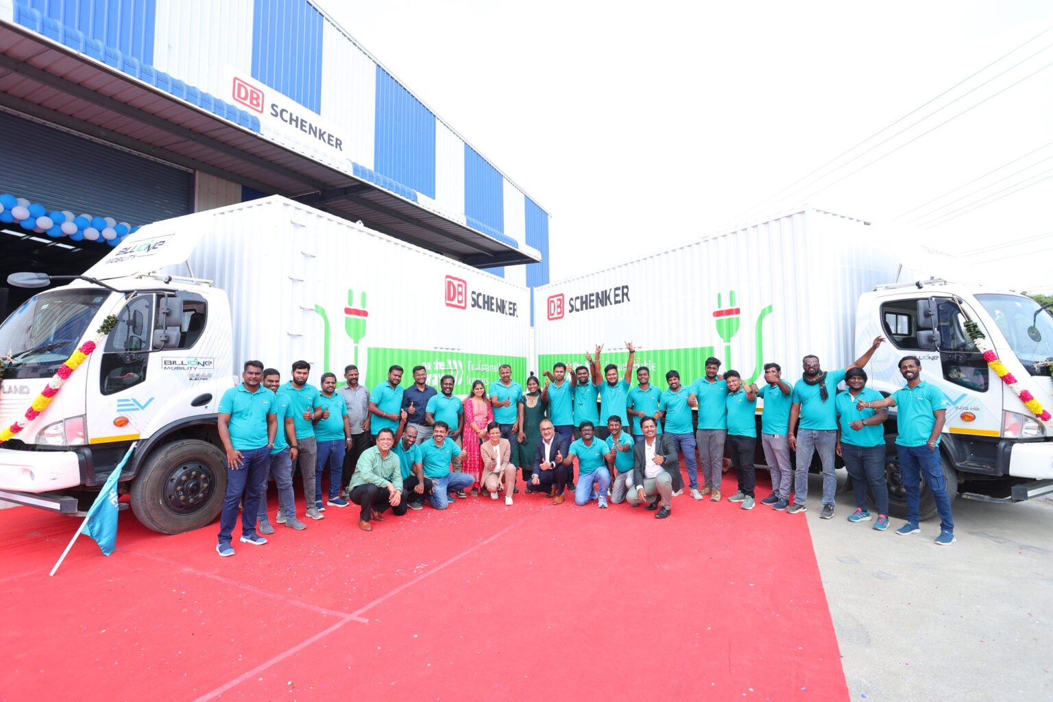 SCM Spectrum - DB Schenker electric truck driving on a highway, promoting sustainable logistics and reducing carbon emissions.