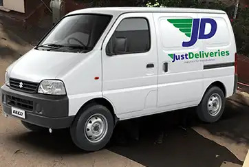 SCM SPECTRUM - JustDeliveries delivery van operating in an urban Indian city, representing mid-mile cold chain logistics