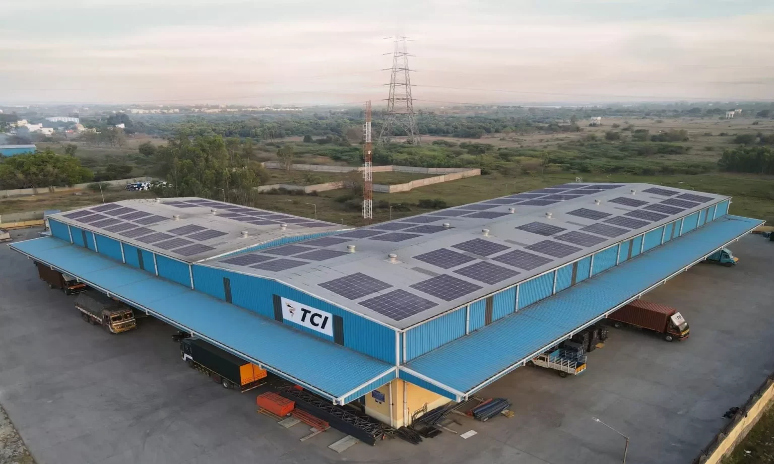 SCM SPECTRUM - TCI trucks and cargo containers at a multimodal logistics hub