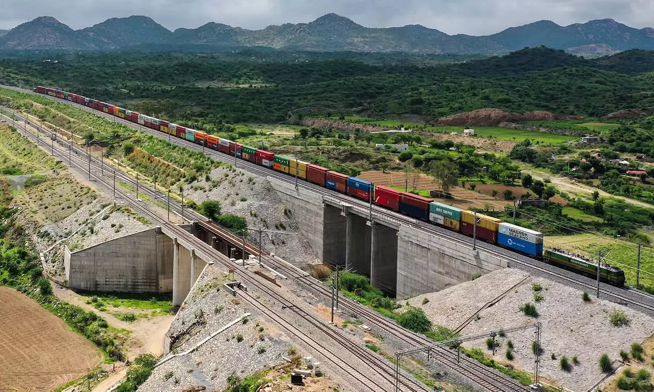 SCM SPECTRUM - Western Dedicated Freight Corridor freight train transporting double-stack containers across industrial hubs