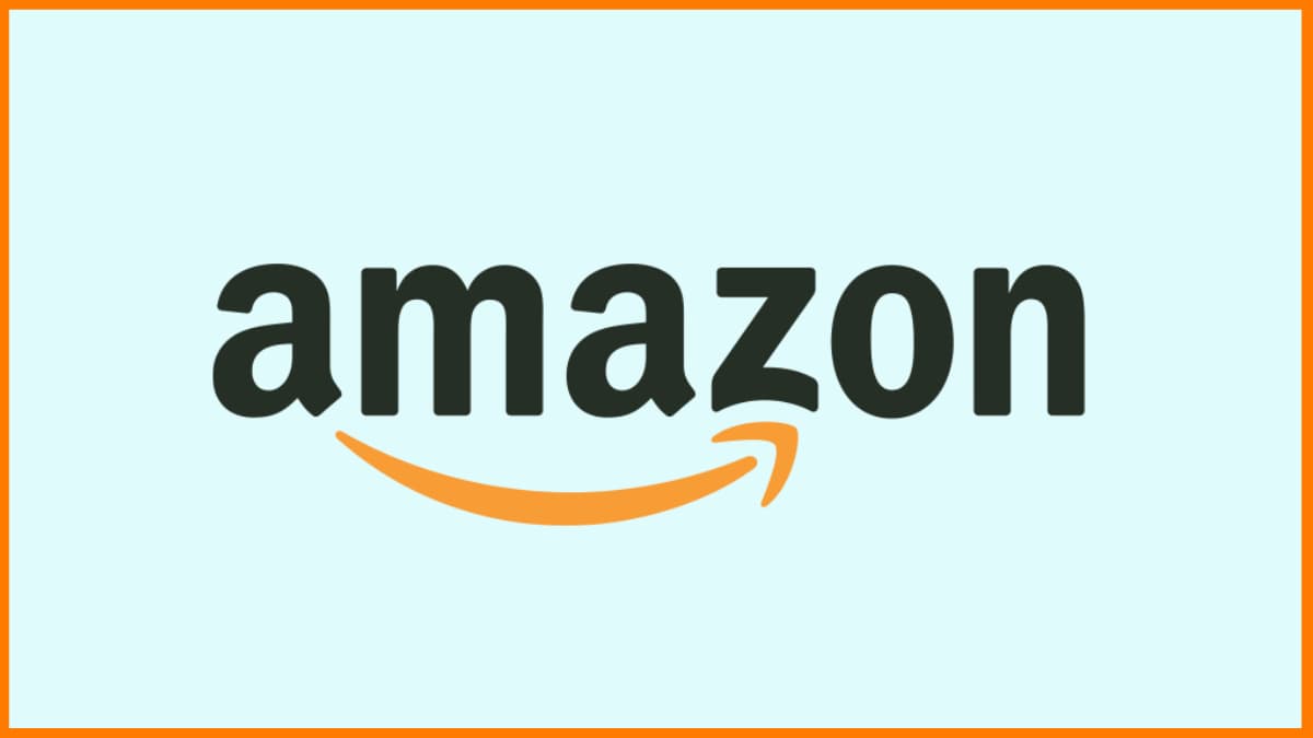 SCM Spectrum - Amazon delivery truck parked outside a warehouse with workers loading packages