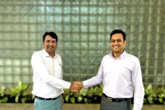 MatchLog and Accuracy Shipping executives shaking hands after partnership agreement on smart logistics