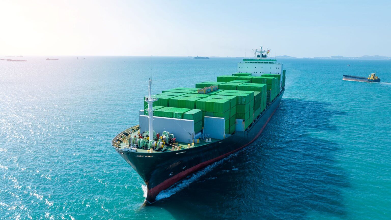 Green hybrid tugboat operating at an Indian port under the Sustainability Indexing initiative for greener shipping.