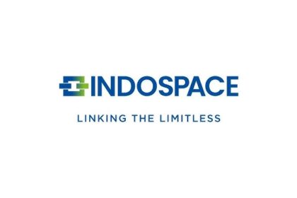 Anshuman Singh, newly appointed MD & CEO of IndoSpace, standing in front of a modern logistics park facility.